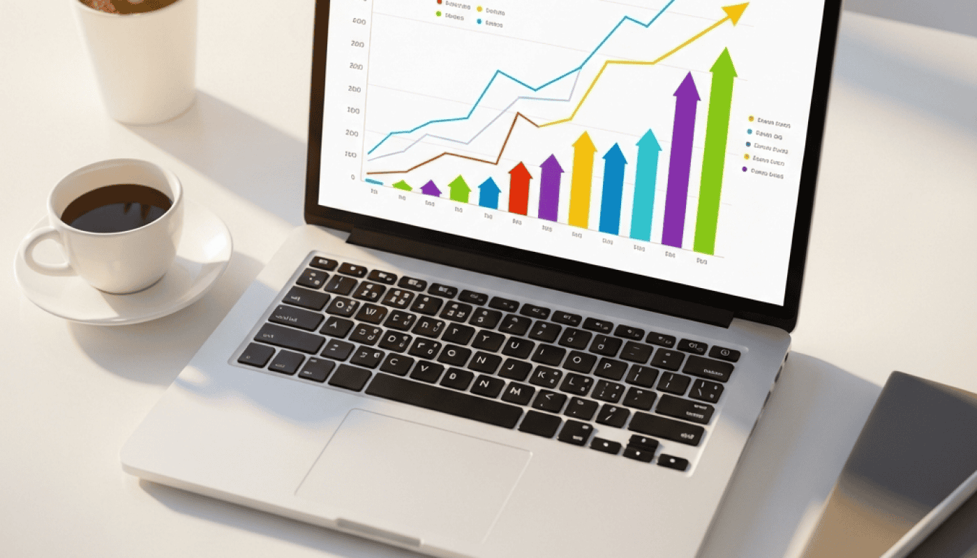 Business analytics dashboard showing growth charts on a laptop screen.